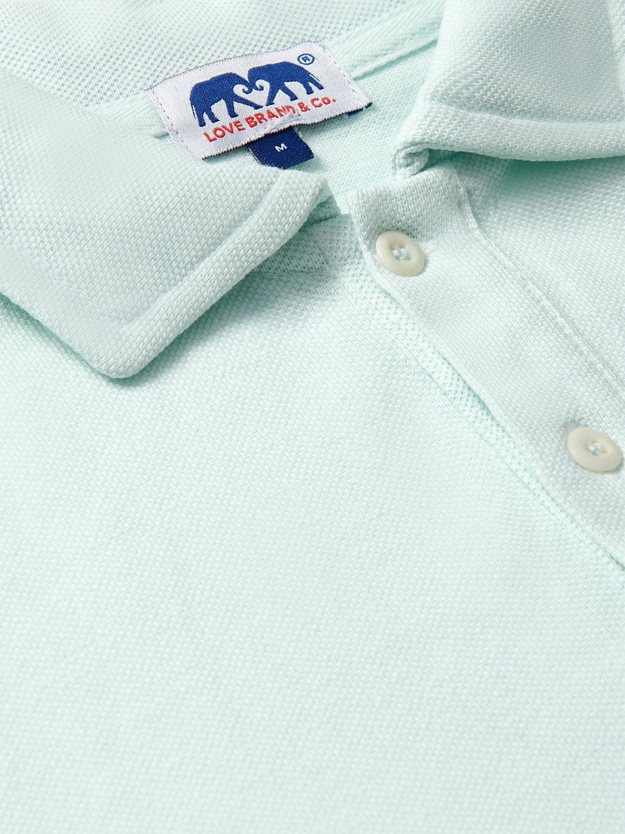 Close-up of the Men's Sea Air Pensacola Polo Shirt in pastel hue, featuring breathable cotton fabric and button details.