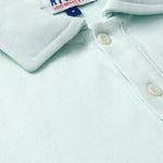 Close-up of the Men's Sea Air Pensacola Polo Shirt in pastel hue, featuring breathable cotton fabric and button details.