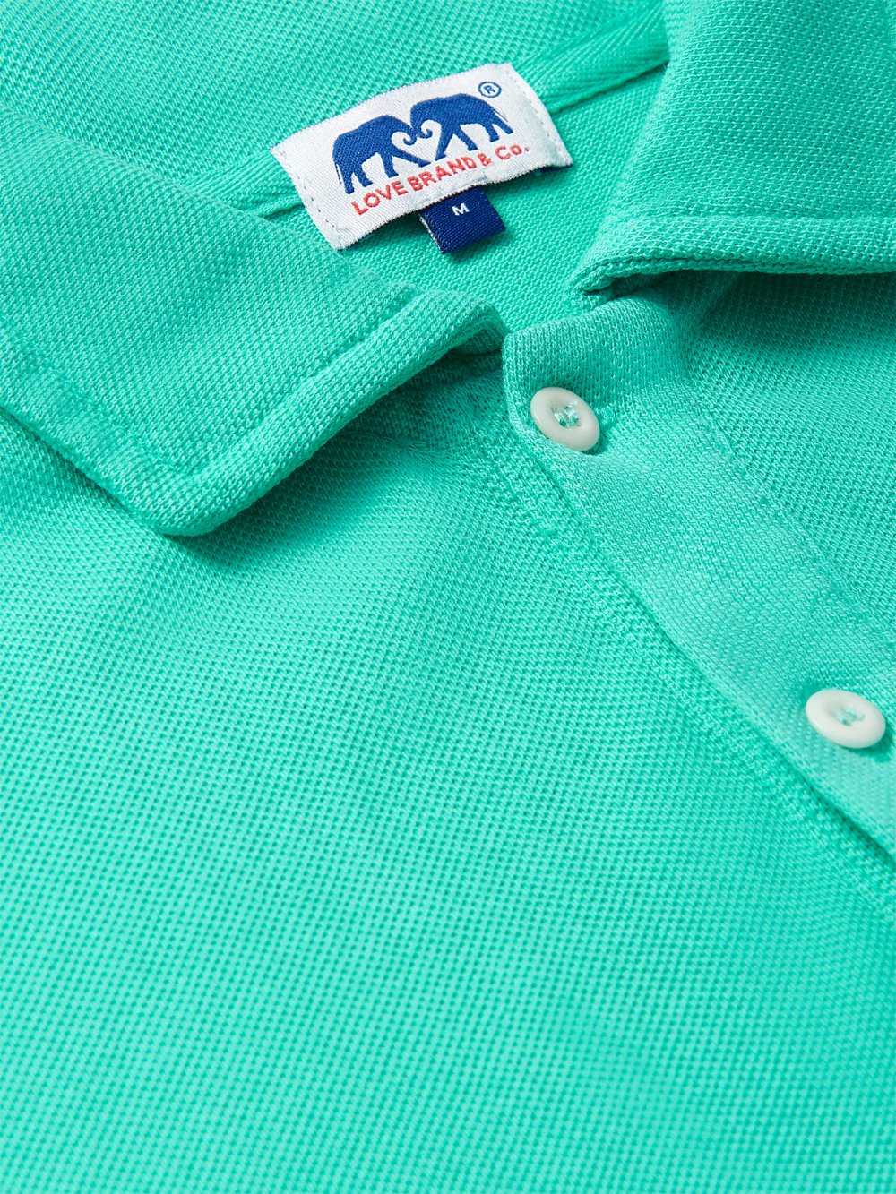 Close-up of Men's Sicilian Green Pensacola Polo Shirt showcasing the collar, buttons, and texture.