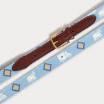 Needlepoint Belt - The G.E.M., featuring blue fabric with white Asian elephants and colorful Indian truck motifs, genuine leather strap, and solid brass buckle.