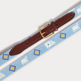 Needlepoint Belt - The G.E.M., featuring blue fabric with white Asian elephants and colorful Indian truck motifs, genuine leather strap, and solid brass buckle.