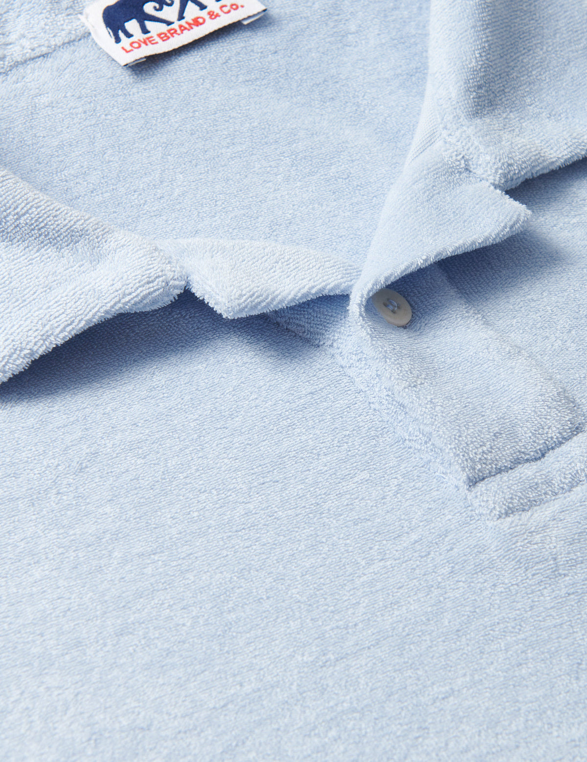 Powell Mens Sky Blue Terry towelling Polo Shirt close-up view.