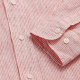 Close-up view of the Men's Red Lines Abaco Linen Shirt showing thin red stripes and white buttons.