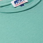 Men's Riviera Green Lockhart T Shirt made with 100% cotton, featuring bold green color and Love Brand & Co. label on the neckline.