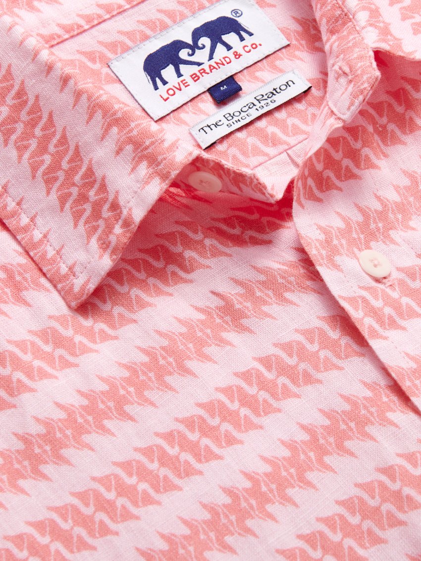 Close-up view of Love Brand & Co. Mens Roseate Spoonbill Manjack Linen Shirt. Pink men's linen shirt featuring bird pattern in an old money style.