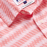 Close-up view of Love Brand & Co. Mens Roseate Spoonbill Manjack Linen Shirt. Pink men's linen shirt featuring bird pattern in an old money style.