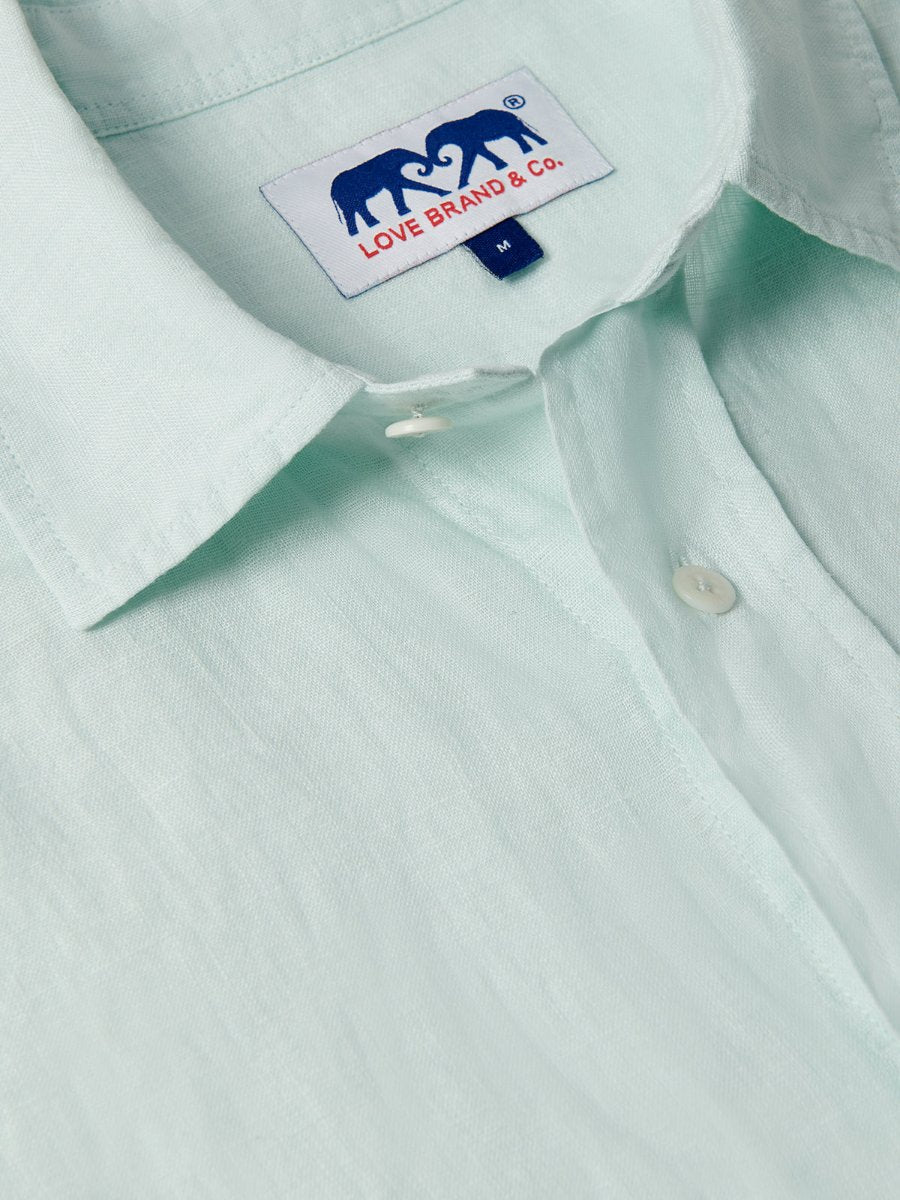 Close-up of the Sea Air Manjack mens Linen Shirt in a subtle pastel hue, showcasing lightweight, breathable fabric and buttons.