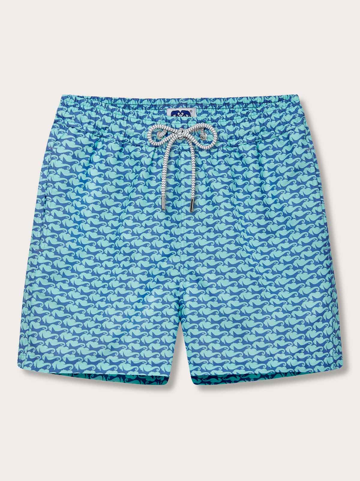 Men's Seahorses and Orcas Staniel Swim Shorts featuring blue and green marine animal print on quick-dry, recycled fabric.