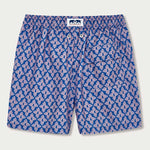 Men's Palm Paradise Staniel Swim Shorts. Patterned swim shorts with pastel pink Monstera leaf print on blue background.