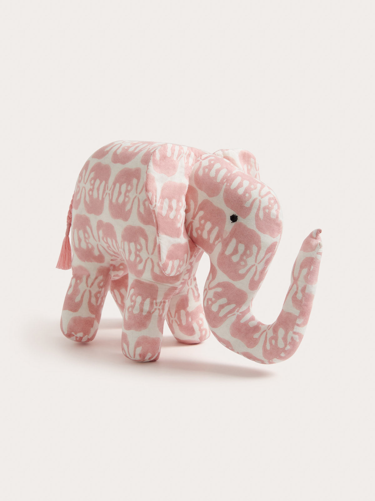 Decorative soft ornament in the shape of an elephant, featuring a pink 'Elephants of India' print on 80s cotton voile.