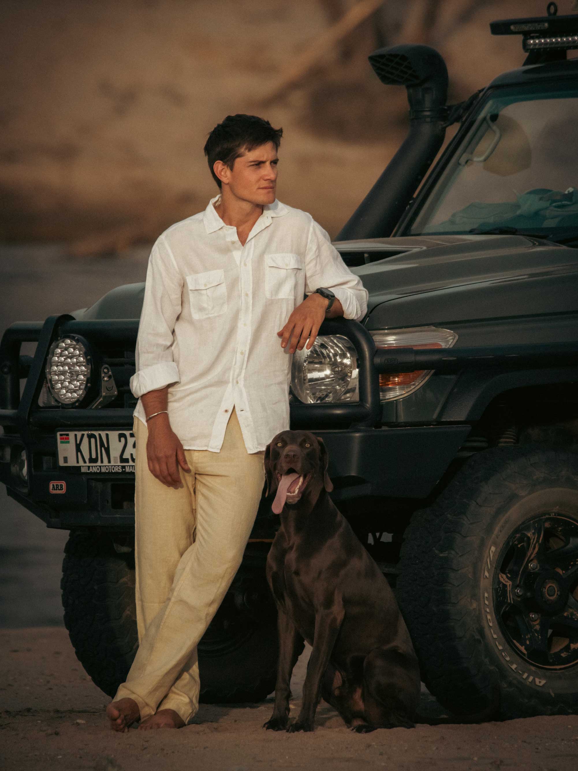 Taru Carr-Hartley wearing Love Brand Men's White Andros Hemp Shirt and Men's Stone Randall Linen Trousers