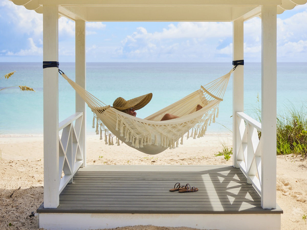 The Potlatch Club hammock on the beach overlooking the turquoise waters of the Atlantic Ocean