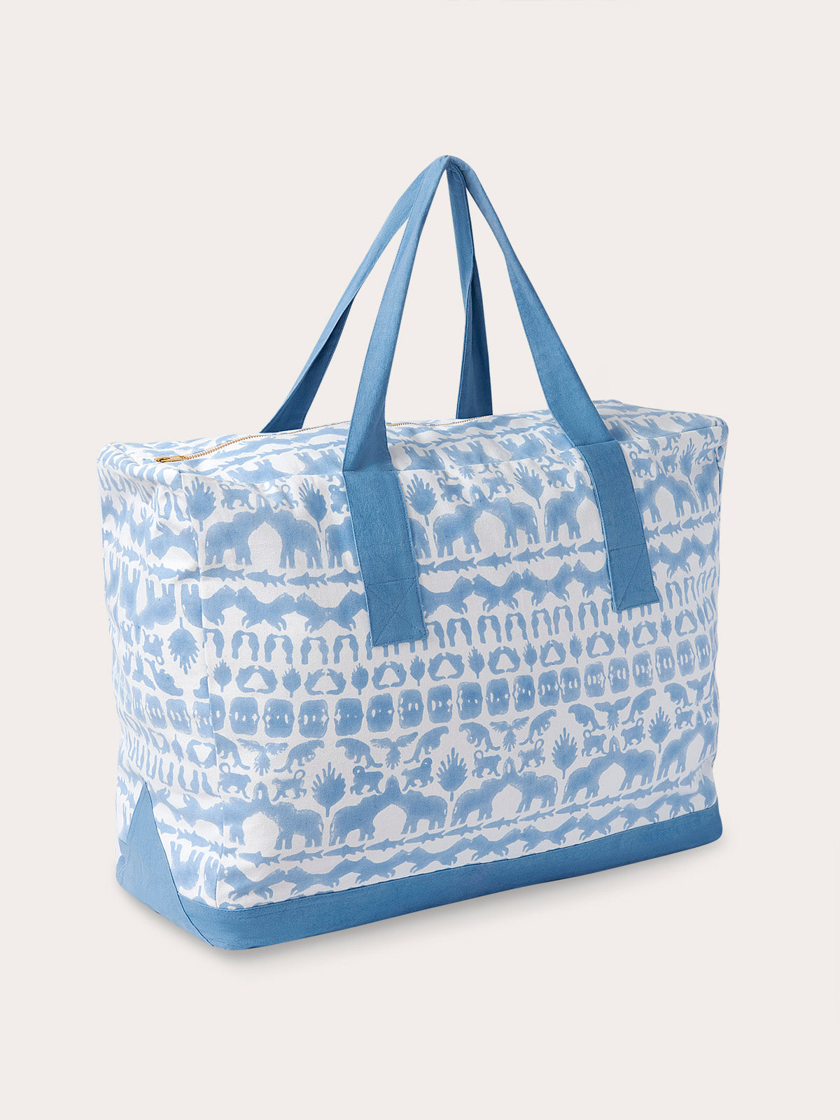 Sky blue canvas tote bag with animal prints featuring elephants, tigers, and hornbills, crafted with premium cotton canvas and finished with blue straps.