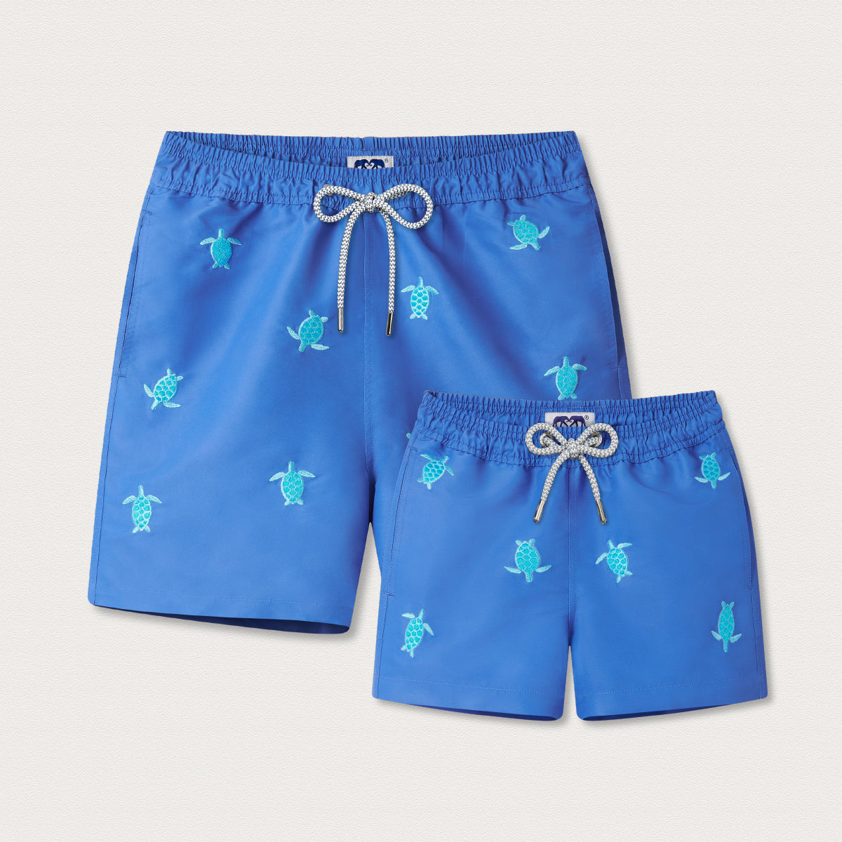 Blue swim shorts with embroidered turtles