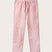 Pink linen trousers featuring love brand & co elephants of india print. Front view of drawstring trousers showing elastic waist, perfect for old money styling.