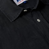 Men's black linen shirt with short sleeves and a relaxed fit.