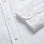 Men's White Andros Hemp Shirt with pleated double chest pockets and signature corozo nut buttons, made from 100% organic hemp for strength and comfort.