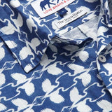 Close-up of Men's White Heron Abaco Linen Shirt. White and navy men's linen shirt featuring heron print design with Love Brand and The Boca Raton labels.