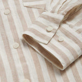 Womens Coconut Stripe Sapodilla Linen Shirt Dress by love brand & co. Close-up view of brown and white linen dress cuffs with corozo nut buttons.