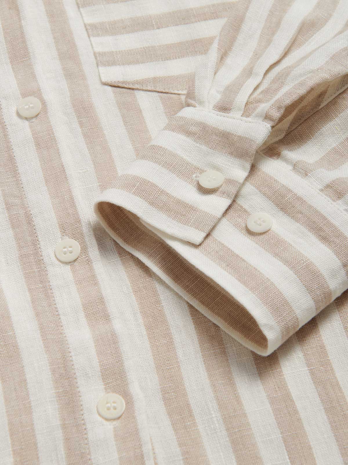 Womens Coconut Stripe Sapodilla Linen Shirt Dress by love brand & co. Close-up view of brown and white linen dress cuffs with corozo nut buttons.