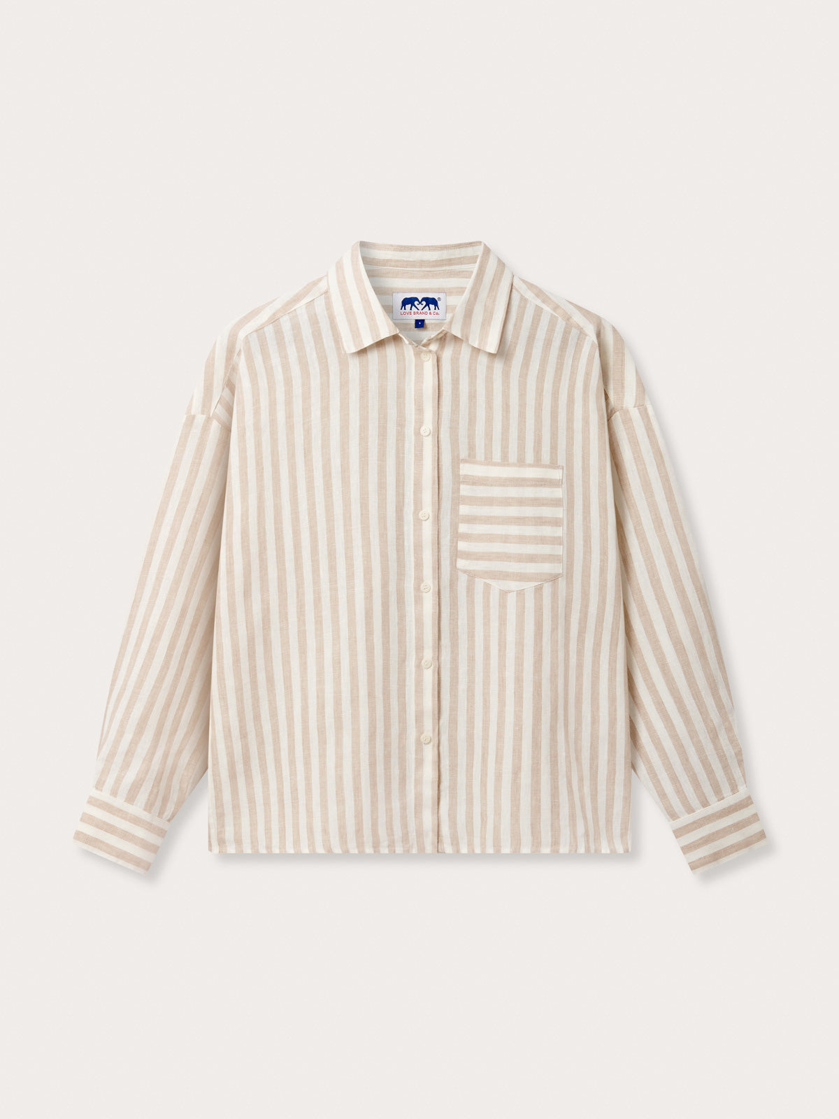 Front view of Womens Coconut Stripe Inagua Linen Shirt. Long-sleeved button-up 100% linen shirt with front pocket. Brown and white striped patterned all over.