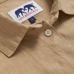 Detailed view of Womens Coconut Inagua Linen Shirt. Long-sleeved brown linen shirt with button-up design and front pocket. Crafted from 100% linen.