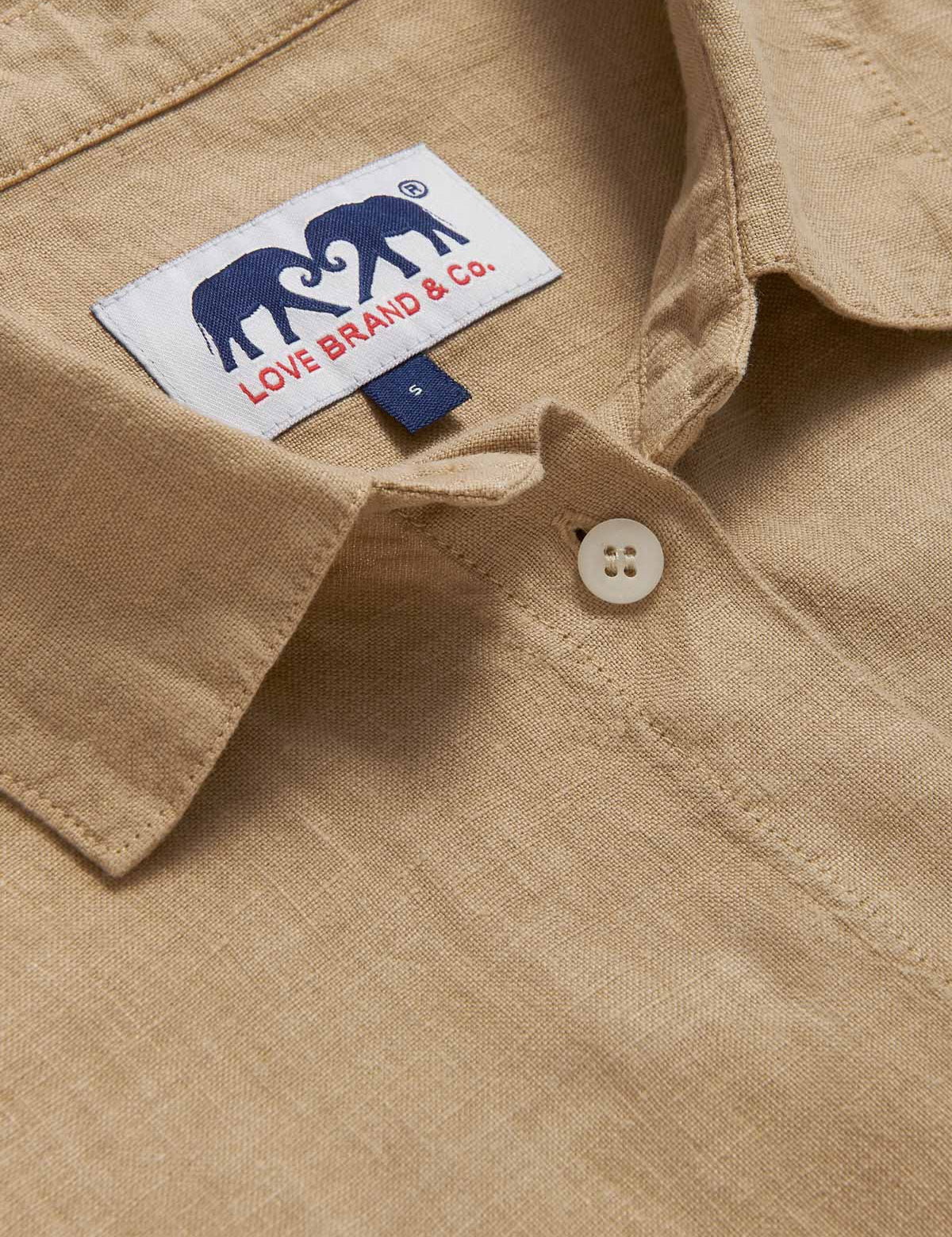 Detailed view of Womens Coconut Inagua Linen Shirt. Long-sleeved brown linen shirt with button-up design and front pocket. Crafted from 100% linen.