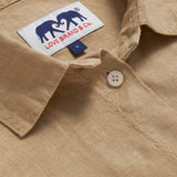 Detailed view of Womens Coconut Inagua Linen Shirt. Long-sleeved brown linen shirt with button-up design and front pocket. Crafted from 100% linen.