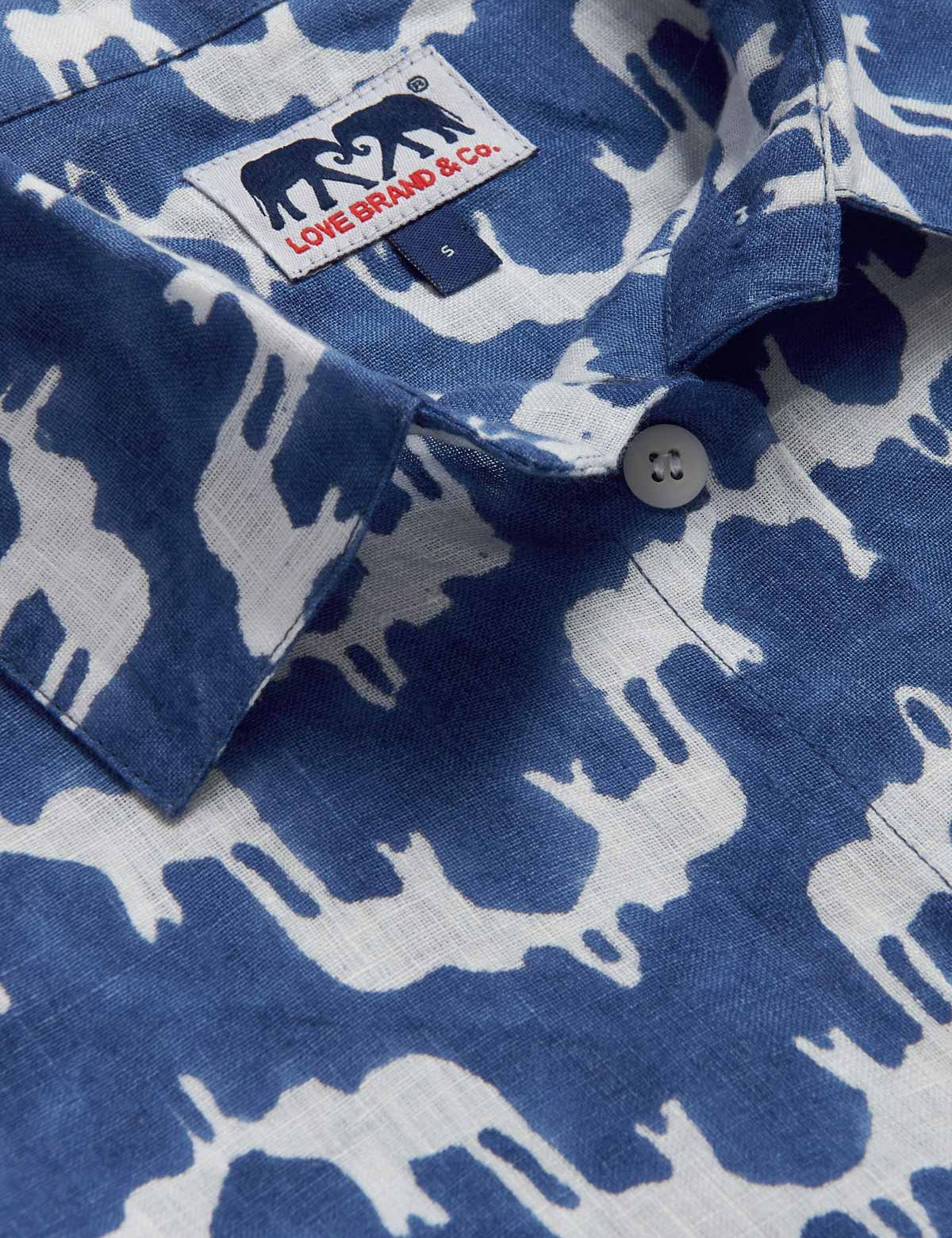 Close-up view of Womens Elephant Palace Blue Inagua Linen Shirt. Long-sleeved button-up linen shirt with front pocket. Blue and white shirt in our bestselling elephant palace blue print.