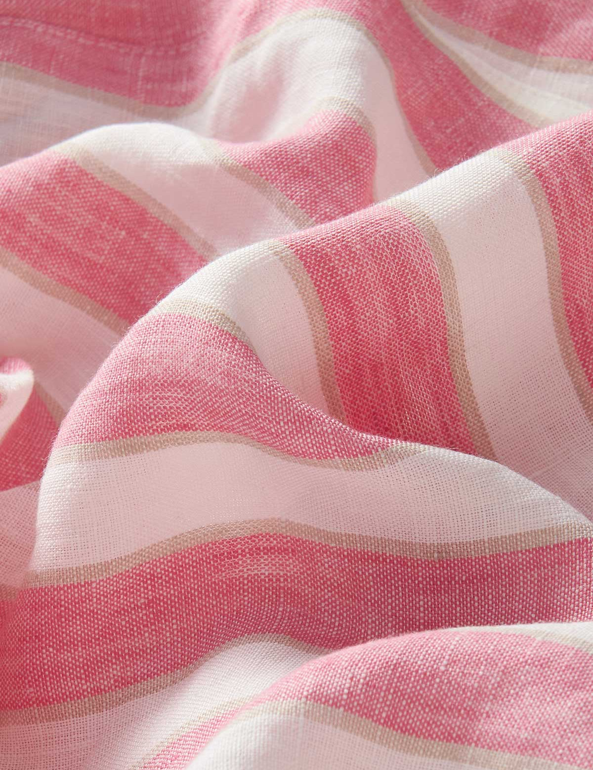 Close-up of Womens Strawberries & Cream Musha Linen Shorts fabric. Pink and white striped linen shorts.