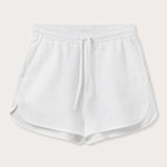 Front view of Womens White Musha Linen Shorts. 100% linen shorts in a relaxed fit with 2 front pockets. Featuring an elastic drawstring waist.