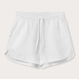 Front view of Womens White Musha Linen Shorts. 100% linen shorts in a relaxed fit with 2 front pockets. Featuring an elastic drawstring waist.