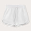 Front view of Womens White Musha Linen Shorts. 100% linen shorts in a relaxed fit with 2 front pockets. Featuring an elastic drawstring waist.