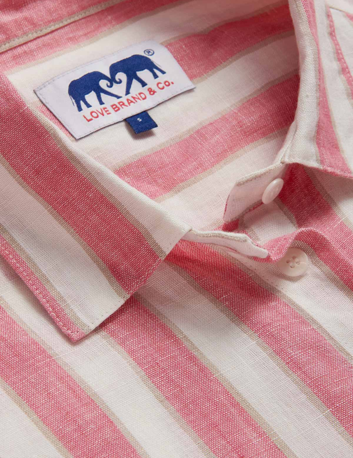 Womens Strawberries & Cream Inagua Linen Shirt by love brand & co. Close-up view of pink and white striped patterned long-sleeved button-up shirt.