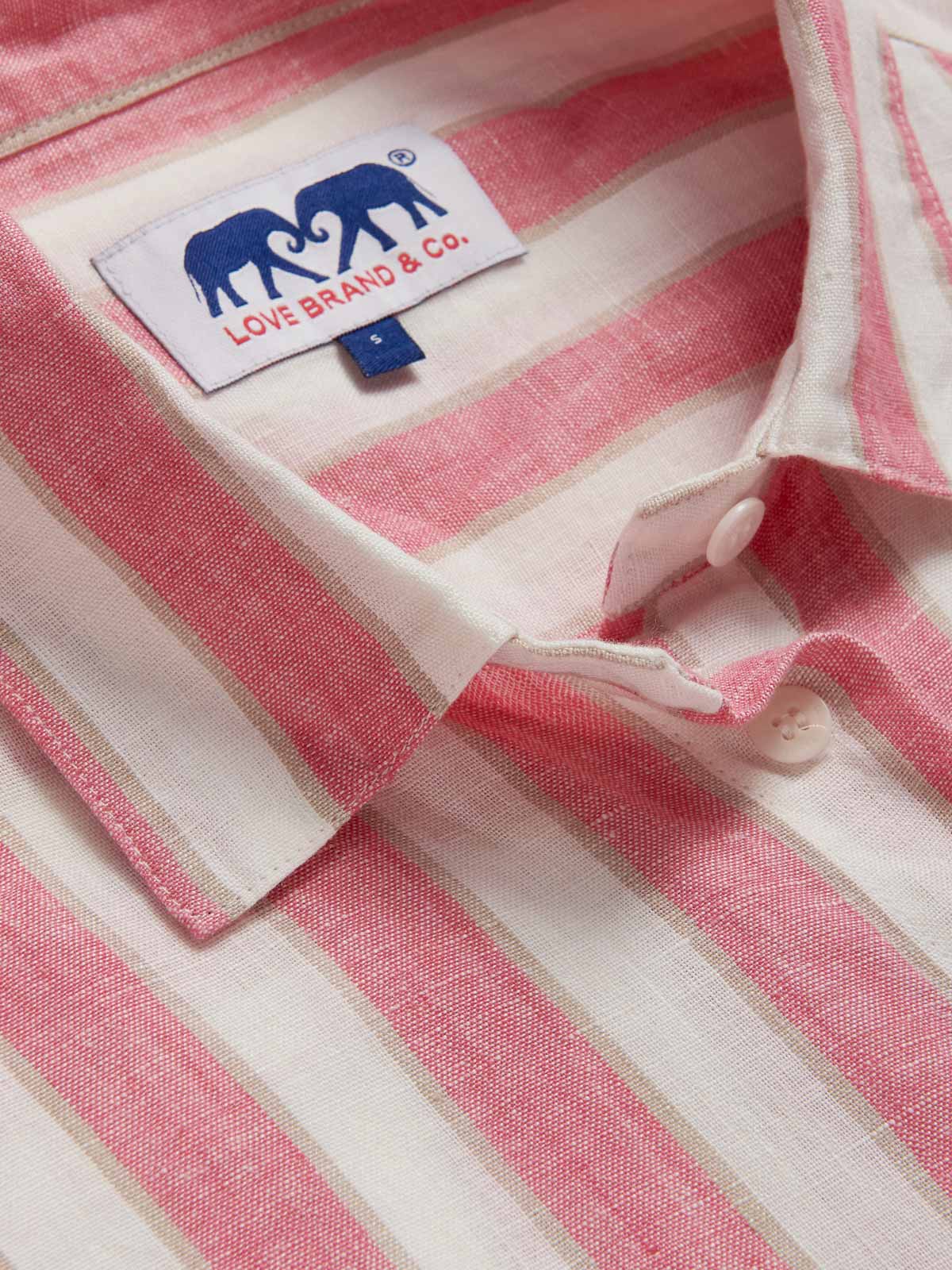 Womens Strawberries & Cream Inagua Linen Shirt by love brand & co. Close-up view of pink and white striped patterned long-sleeved button-up shirt.