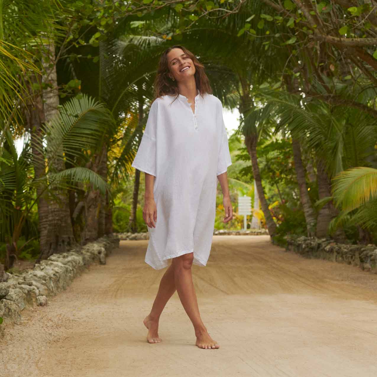 Love Brand beachwear for women showcasing womens linen poncho cover-up in white