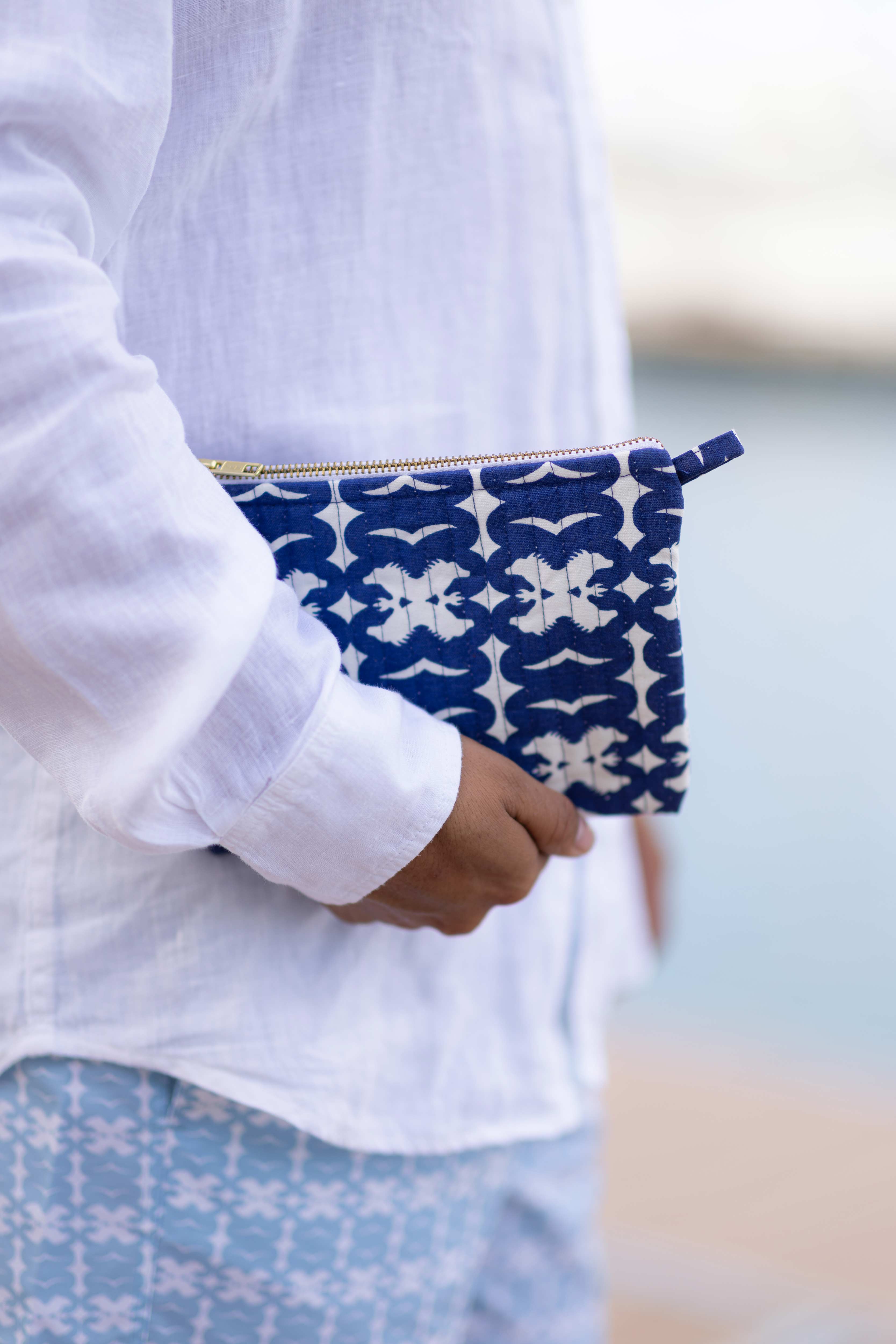 Man holds Biras x Love Brand collaboration bag