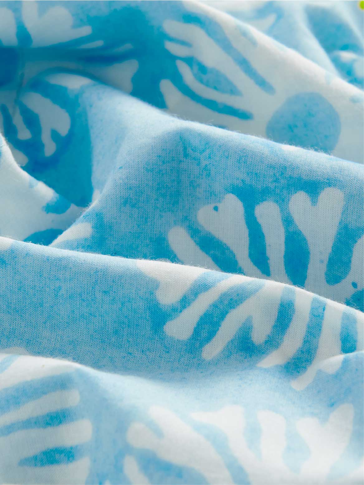 Close-up of blue and white patterned fabric.