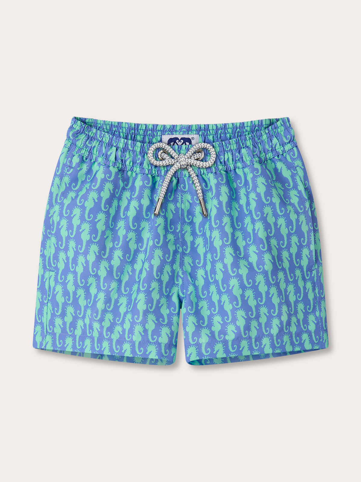 Kids blue swim shorts with seahorse pattern on a white background