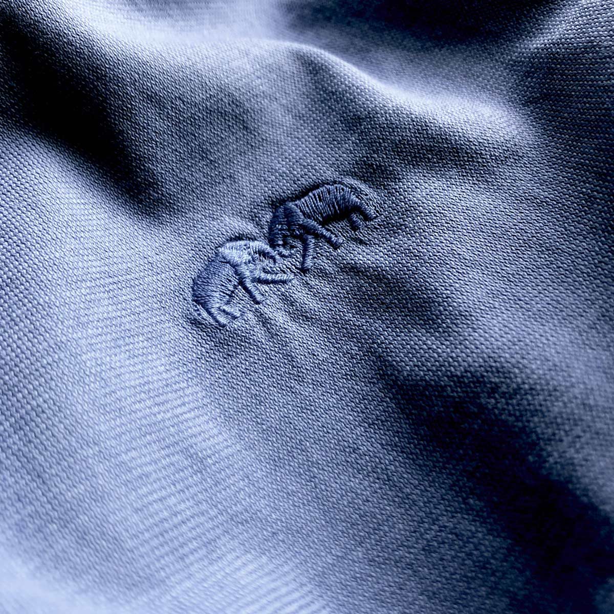 Close-up of Men's Chambray Lockhart T-Shirt fabric with intricate stitching detail.