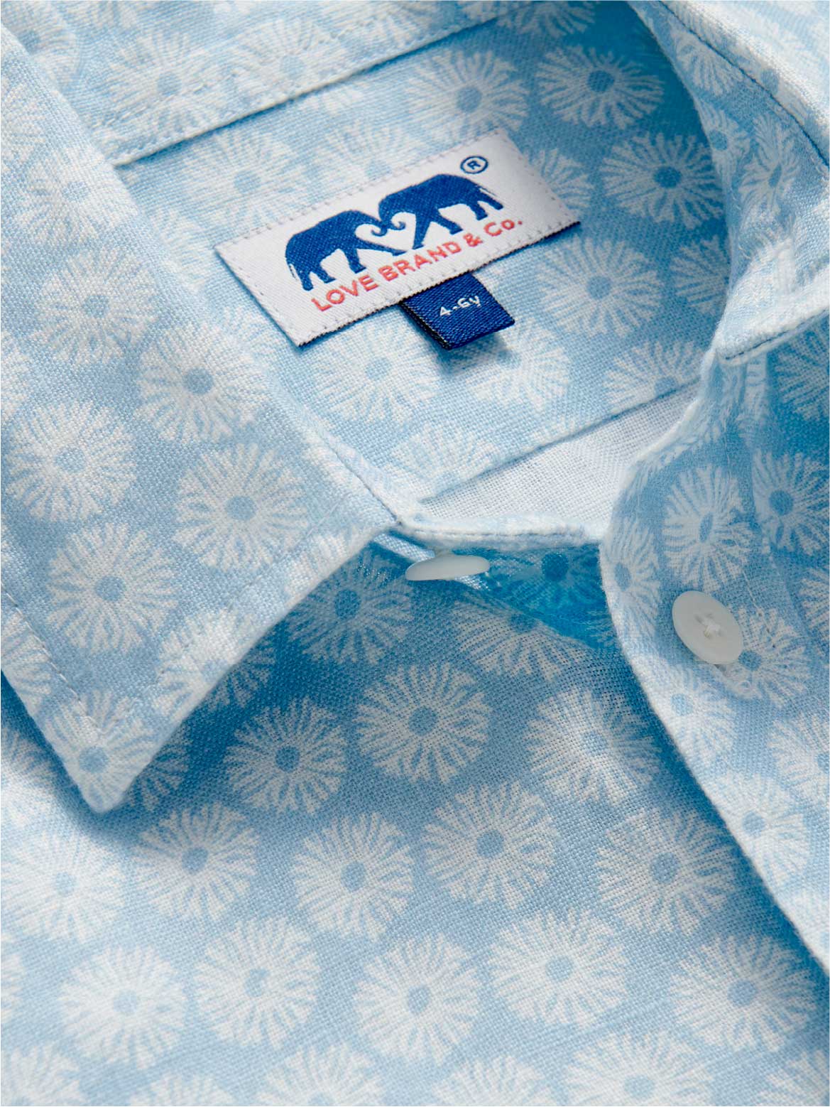 Close-up of kids blue and white linen shirt.