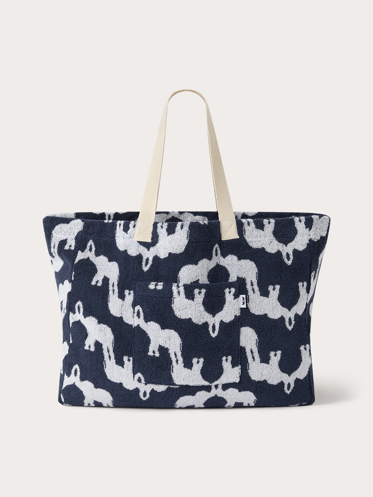 Terry cotton tote bag with elephant design and front pocket.
