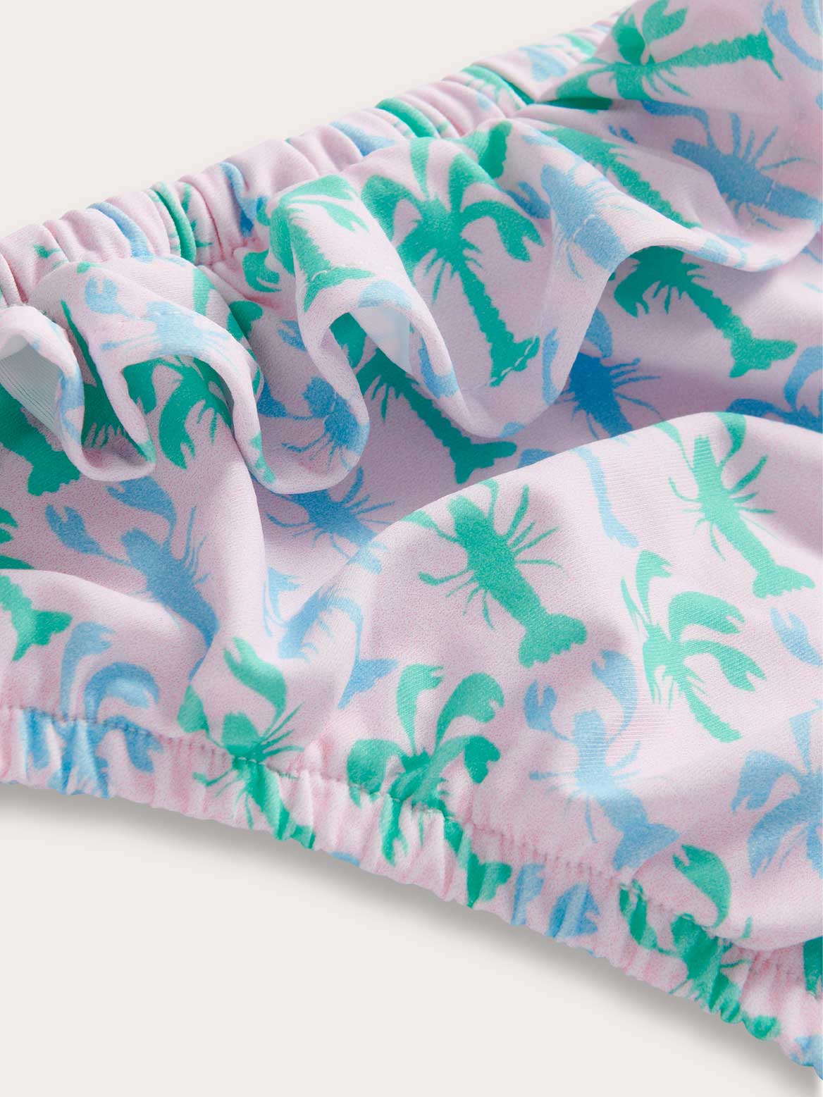 Pink girls swim cover-up with green and blue palm tree and lobster pattern.