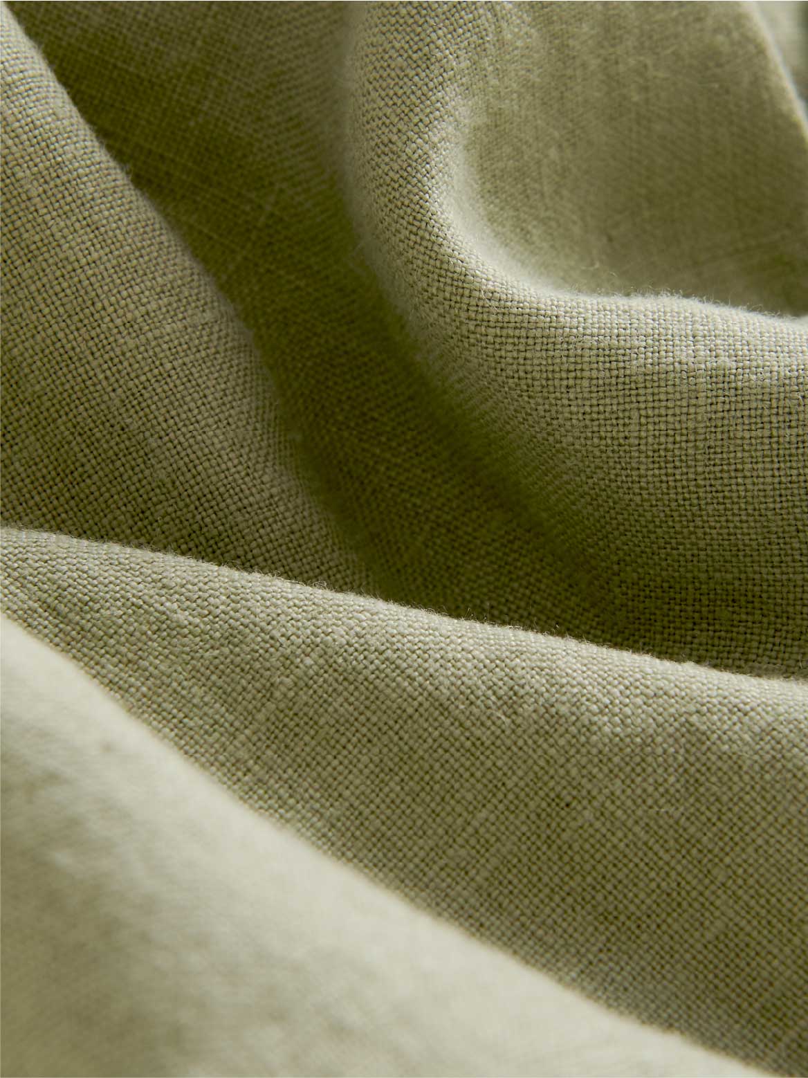 Close-up of green fabric with a textured surface