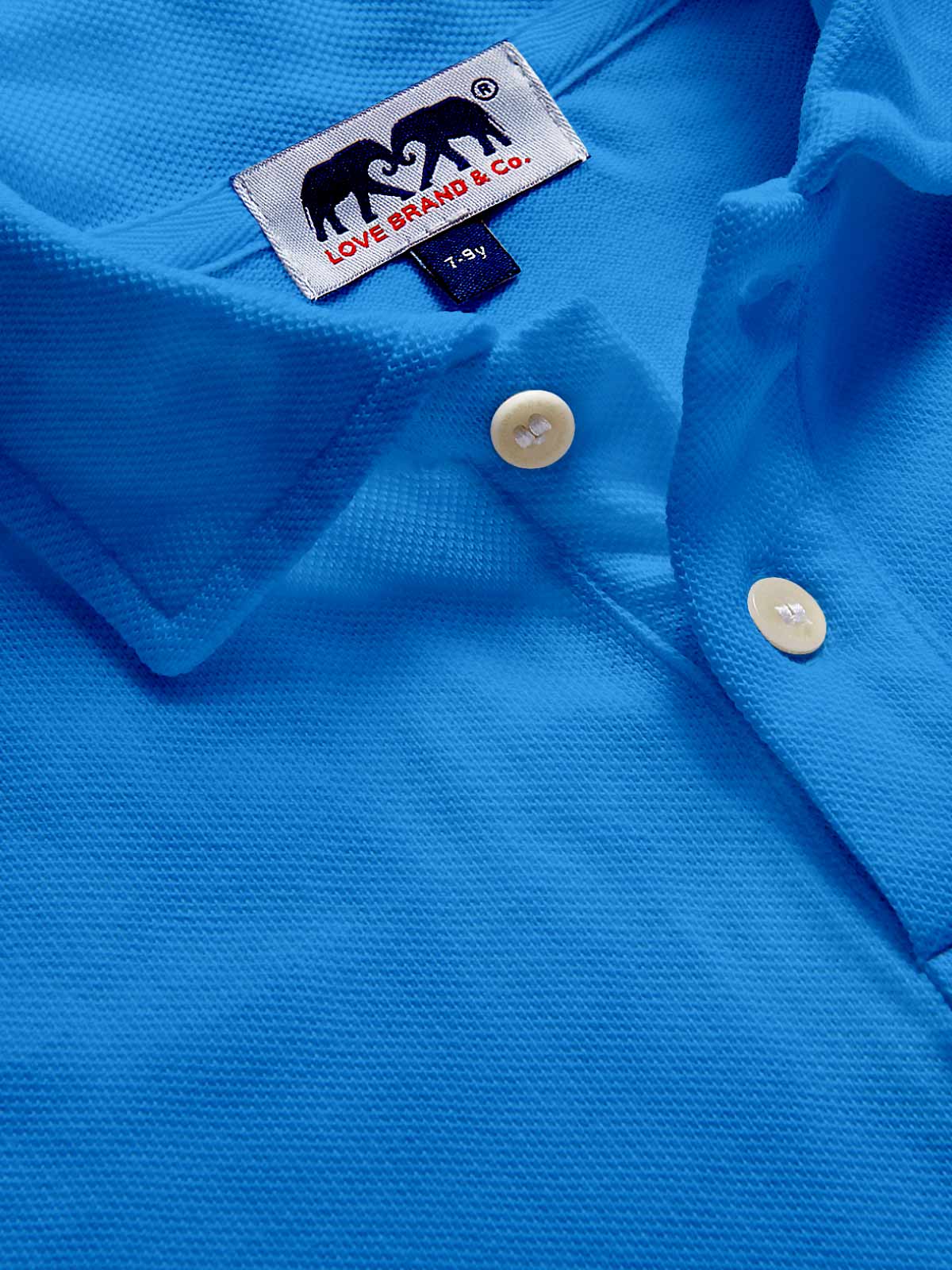 Close-up of a blue polo shirt for kids.