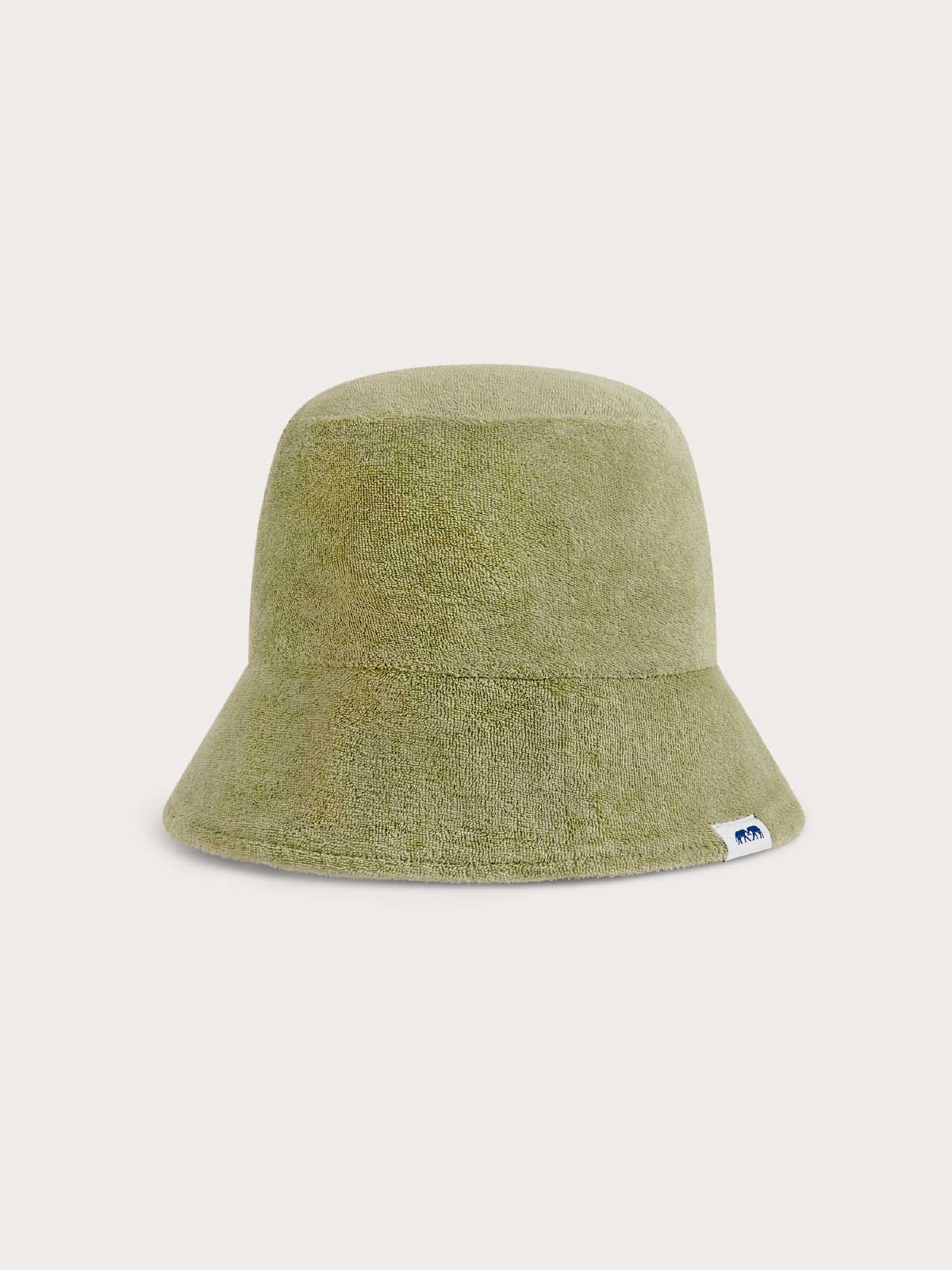 Kids green bucket hat on a light beige background