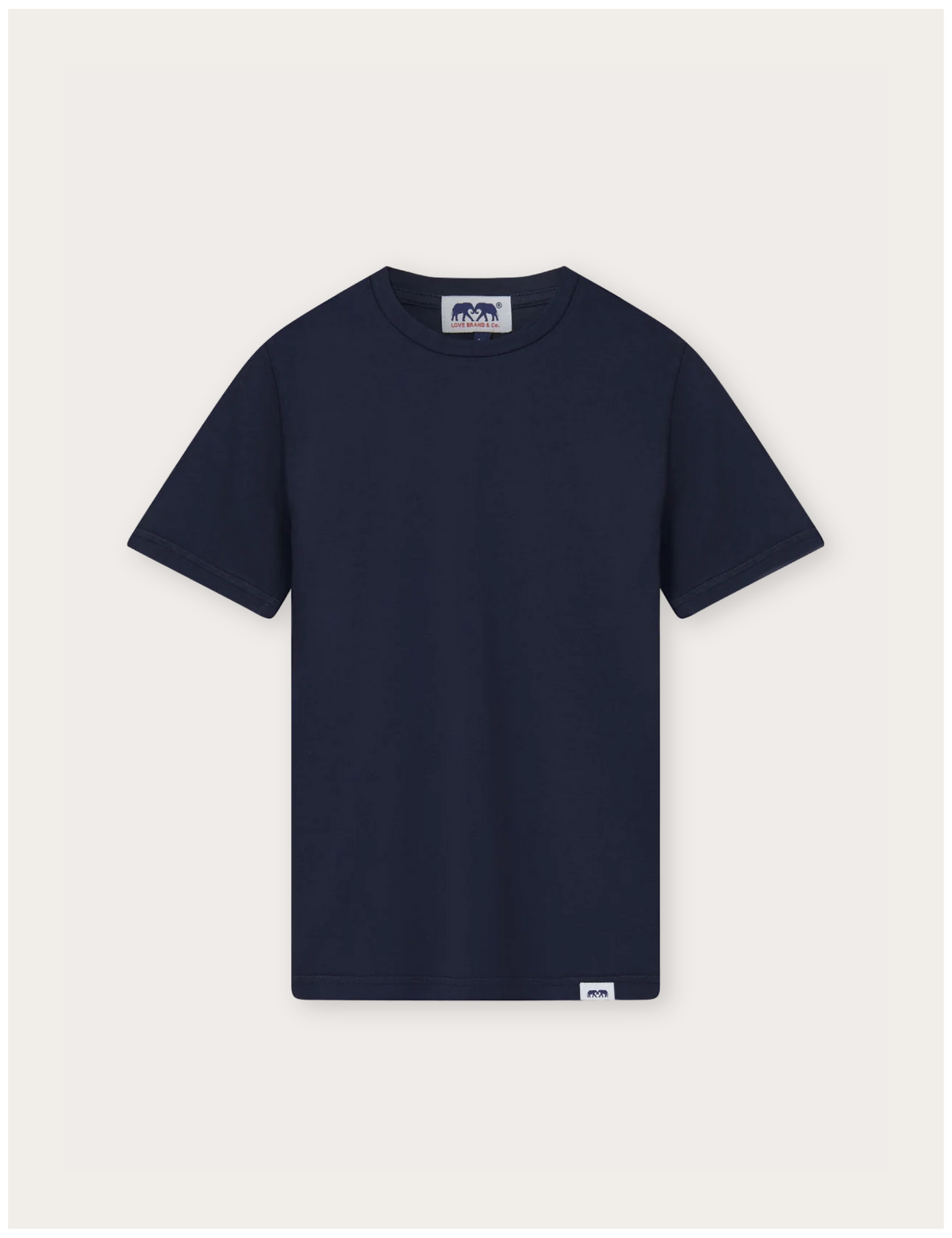 A navy blue short-sleeve crewneck t-shirt with a small white brand label on the bottom hem and a larger logo patch on the inner neck, displayed flat against a light off-white background.