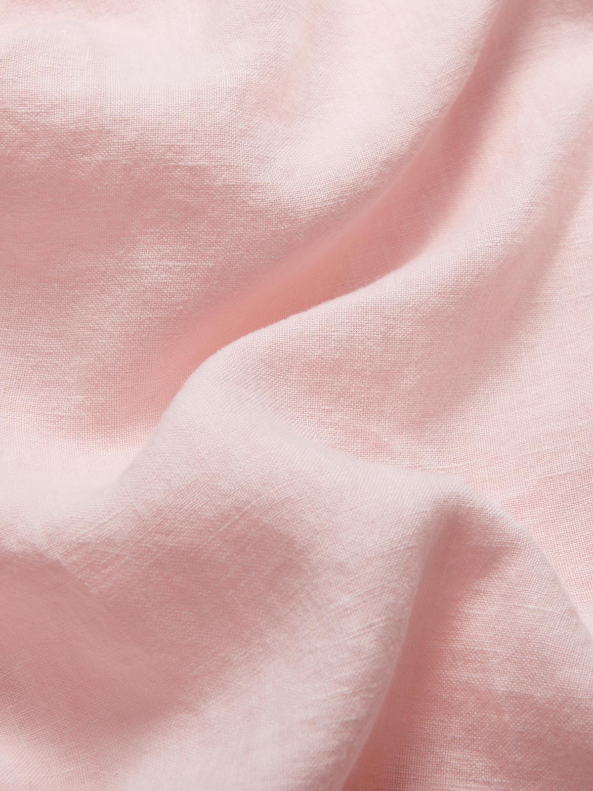 Detailed view of 100% linen fabric of Kids Pastel Pink Joulter Linen Shorts.