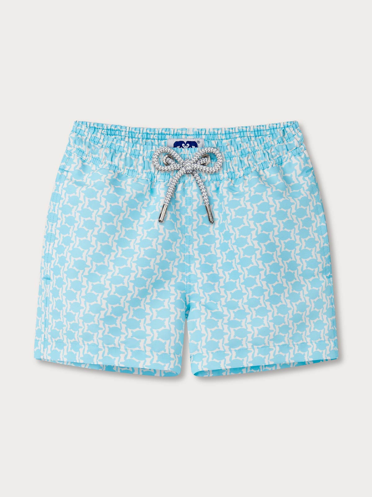 Blue swim shorts with white pattern on a light gray background