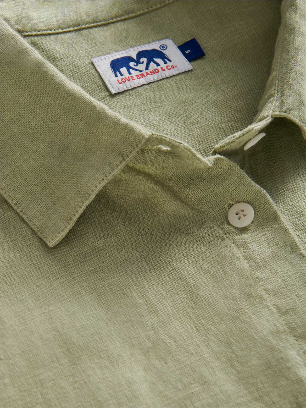 ladies green linen shirt close-up 